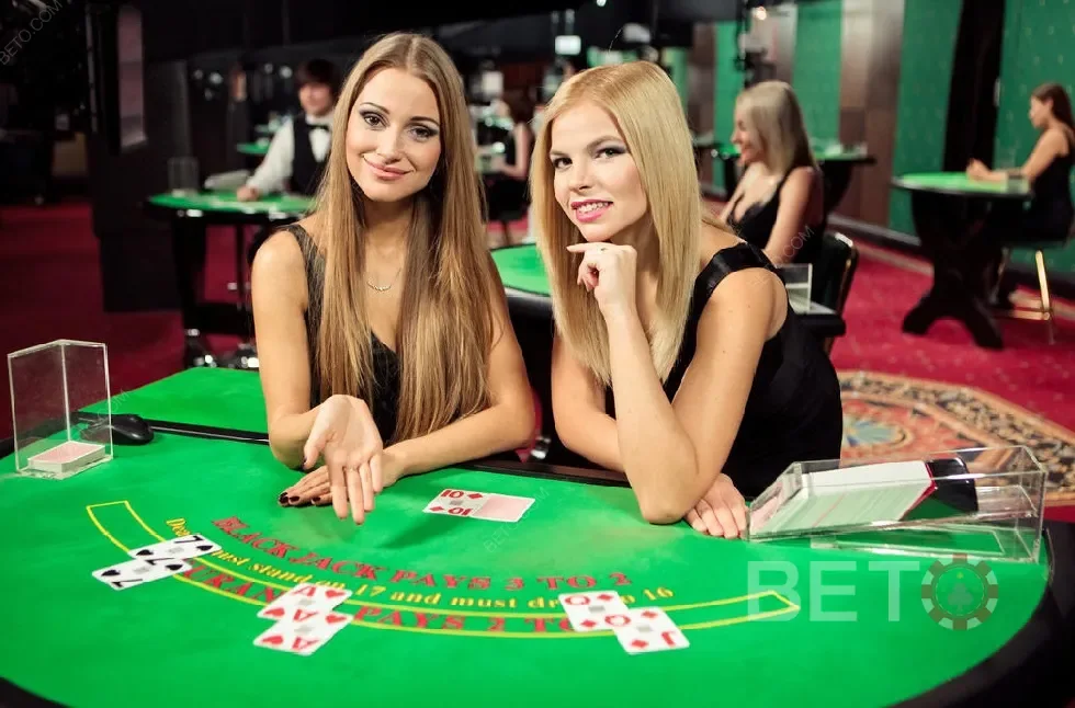 Ruang dealer live dengan meja permainan dan tampilan kamera